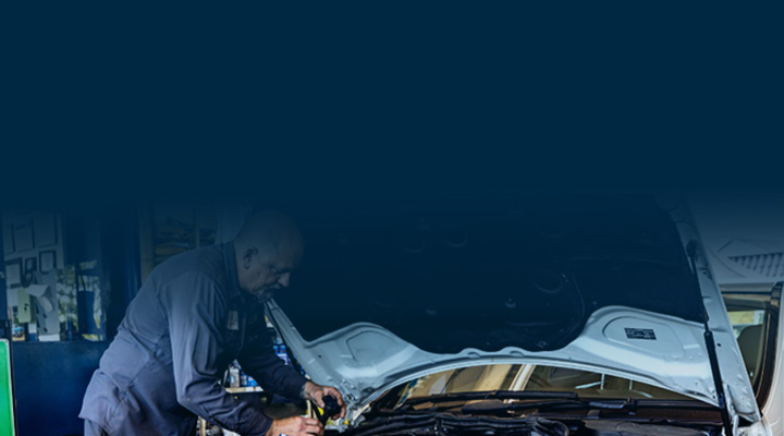 man working on car